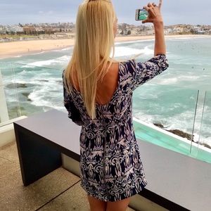 Patterned mini-dress with 3/4 sleeves.